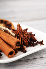 cinnamon, staranise and cloves. winter spices on wooden table