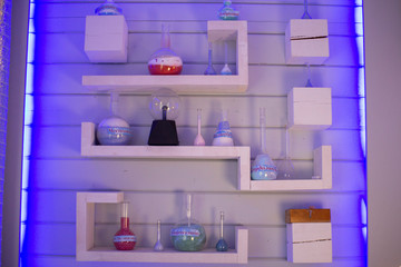 Laboratory utensils in the laboratory. Shelves with flasks and test tubes.