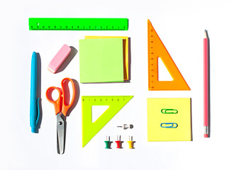 Colorful School stationery concept flat lay on the white paper background. Top view. 