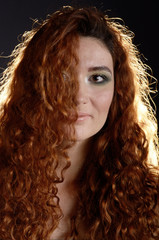 Portrait of young red haired caucasian woman with freckles