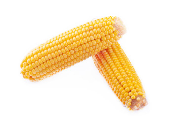 peeled ears of boiled corn on a white background isolated