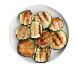 Plate of delicious grilled zucchini slices on white background, top view