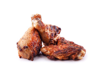 grilled orange chicken legs on a white background isolated 