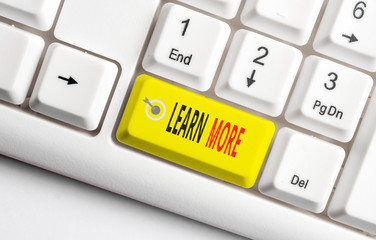 Conceptual hand writing showing Learn More. Concept meaning knowledge or skill acquired by...