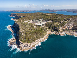 Aerial drone view of North Head, a headland in Manly and part of Sydney Harbour National Park in Sydney, New South Wales, Australia. Manly North Head Wastewater treatment plant in the foreground.