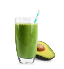 Glass of tasty smoothie with straw and avocado on white background