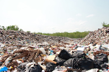 Mountain garbage, large and degraded garbage pile, Pile of stink and toxic residue, waste plastic bottles and other types of plastic waste site in trash dump or landfill. Pollution concept.