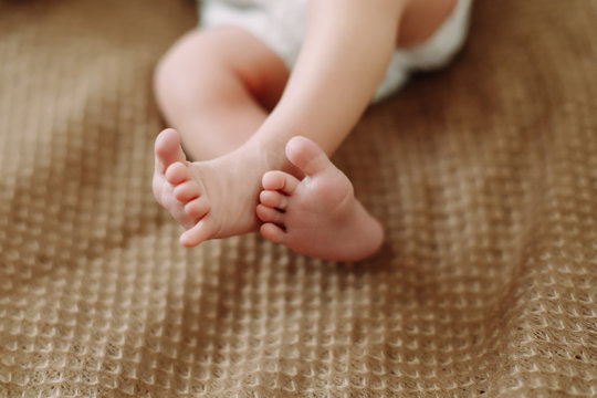 Newborn baby feet. Tiny baby feet closeup. Happy Family concept. 