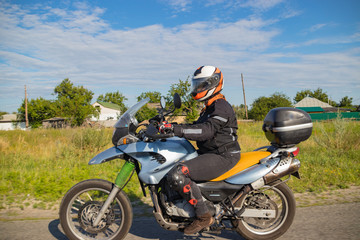 Fototapeta na wymiar Motorcyclist biker driving on the highway