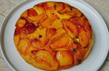 Upside-down cornmeal cake with caramelized peaches and blueberries