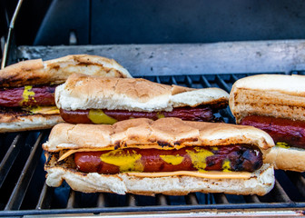Hots dressed in their buns on the grill. Calgary, Alberta, Canada