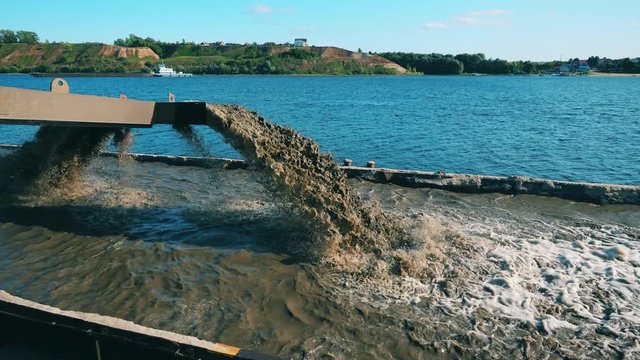 Tray of the dredging vessel with dirty water filling it