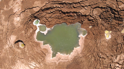 Sinkholes With water in dead sea aerial view 