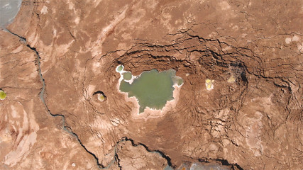 Sinkholes With water in dead sea aerial view 