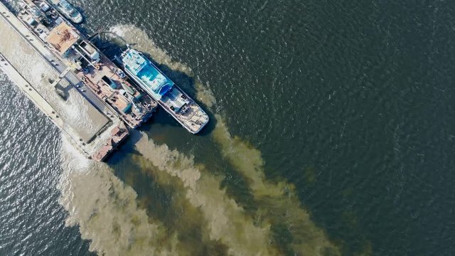 Sand extraction held by the barge in the water