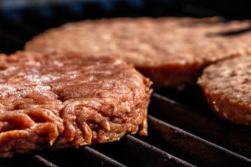 Burgers hit the grill. Calgary, Alberta, Canada
