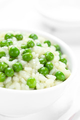 Fresh homemade creamy green pea risotto in bowl (Selective Focus, Focus one third into the risotto)