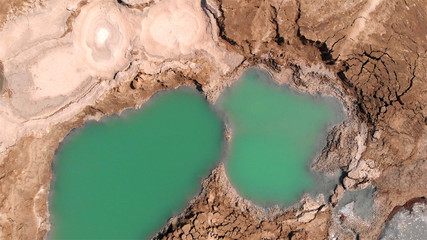 Sinkholes With water in dead sea aerial view 