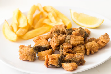 Crispy greaves with fried potatoes, traditional Eastern European dish
