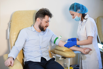 The nurse does a blood test.