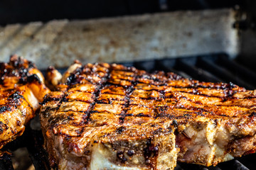 T-bone steaks with home made seasoning on the grill. Calgary, Alberta, Canada