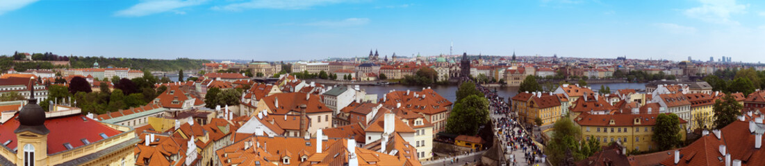 Naklejka na ściany i meble Beautiful panorama of Charles bridge (Karluv Most), Vltava river and red roofs from the Bridge Tower