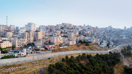 Palestinian Town Behind concrete Wall Aerial view Flying over Palestinian Town Shuafat Close to Jerusalem Drone footage 