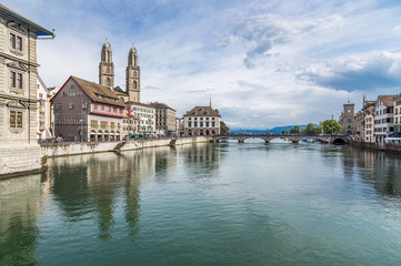 Zurich downtown with famous Grossmunster Church and river Limmat in summer, Switzerland.