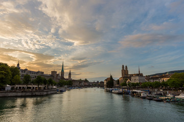 Naklejka premium Zurich downtown skyline with Fraumunster and Grossmunster churches at lake zurich during beautiful sunset, Switzerland