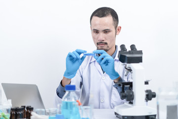 Fototapeta premium Researcher in the laboratory Studying with chemicals And microscopes