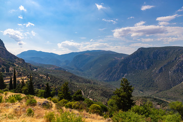 Fototapeta na wymiar Beautiful panoramic view to greek landscape, valley of Phosis and Parnassus mountain near ruins of ancient Delphi, Greece