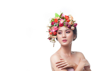 Portrait of beautiful young asian woman with flowers. Brunette woman with luxury makeup. Beautiful girl hand touch to perfect skin. Cosmetic eyeshadow. Perfect Creative Make up and Hair Style.