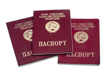 Passports of the Russian Federation and the Soviet Union on a white background.