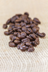 Closeup of roasted black coffee beans depth of field