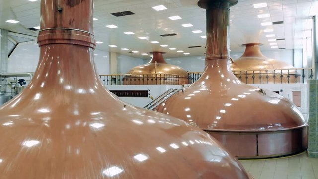 Top view of bronze kettles in the brewery unit
