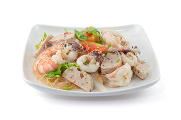 Thai Style spicy seafood salad with noodle isolated on the white background