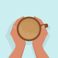 Women's hands are warming, gently holding a cup of hot cocoa, with froth. View from above. On a light blue background, with shadow. Flat style.