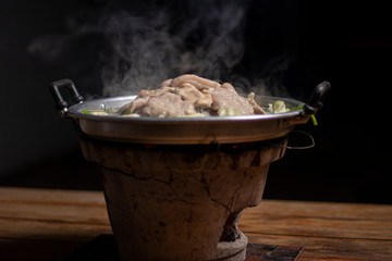 Thai Barbecue Buffet with smoke on the black background