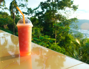Fresh juice fruit, healthy drink on bar counter, overlooking the jungle