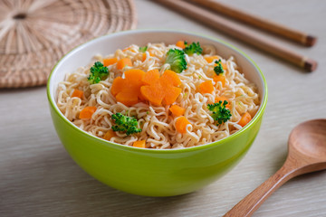 Instant noodle with vegetables in bowl