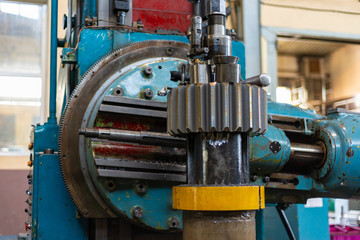 Obraz premium Gear cutting machine at a machine-building enterprise, metal cutting.