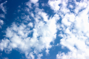 white clouds against blue sky. Blue sky against white clouds