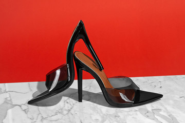 Girl shoes woman shoes heels on red and marble background 