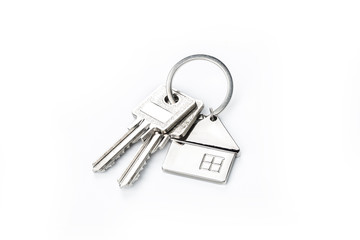 Key placed on top of white background，Purchase concept