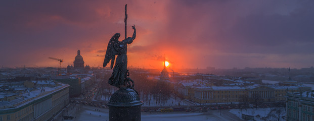 Angel of Saint-Petersburg in snowy winter sunset