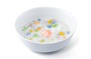 Bua Loi Egg Sweet, Thai dessert with colorful ball flour, Sticy rice pearls in coconut milk with poached egg in light syrup isolated on white background