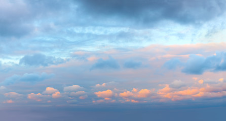 Romantic sundown sunrise sky with colorful clouds