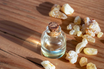 A bottle of essential oil with frankincense resin