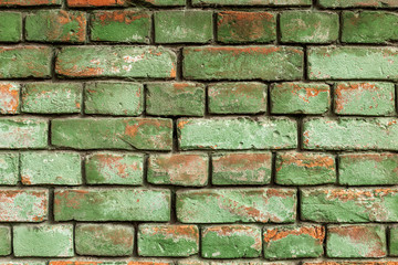 Old green brick wall, rustic texture, design background.