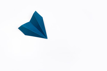 Blue paper airplane isolated on white background. top view